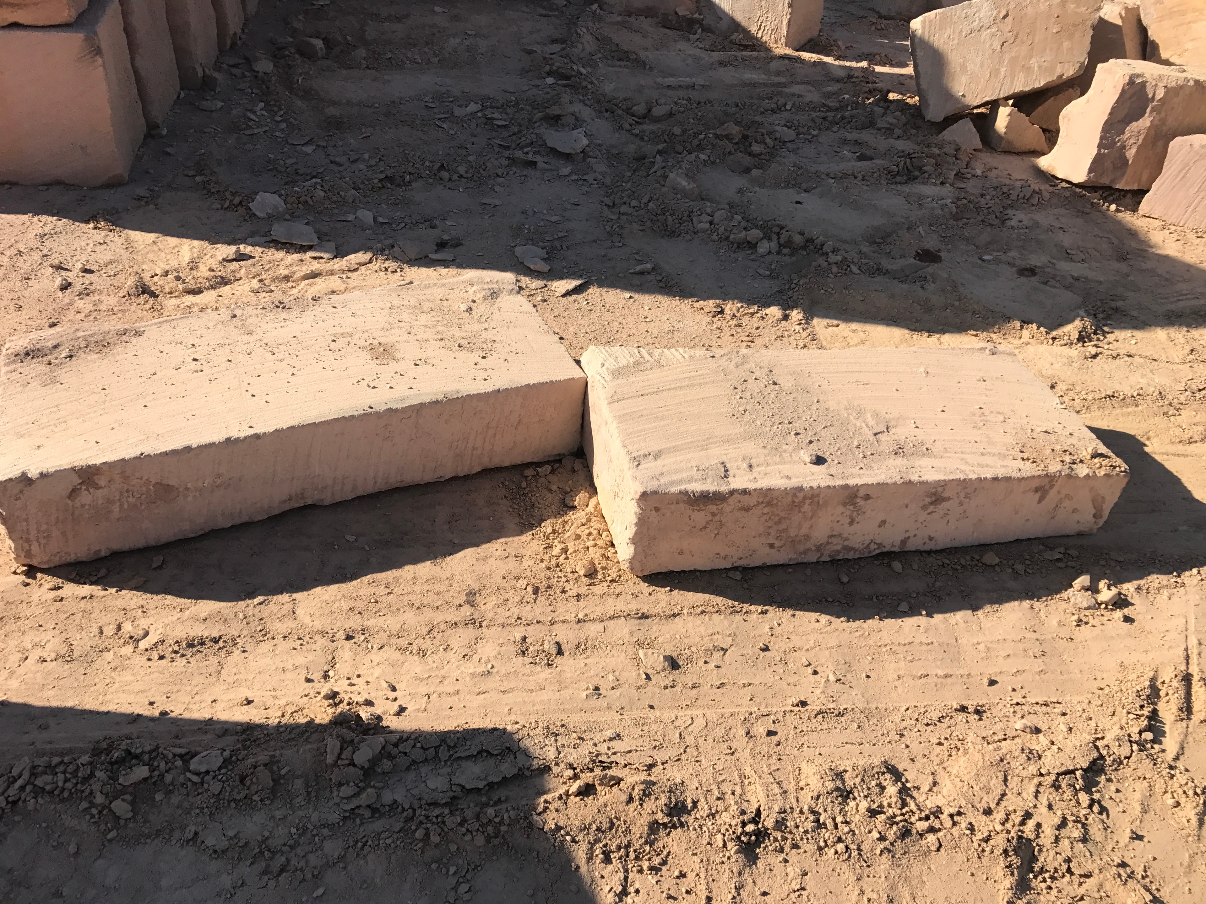 Two flat sandstone slabs on quarry ground ready for use