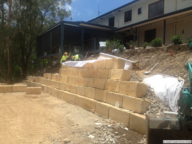 Blocks being fitted for a retaining wall on the Gold Coast