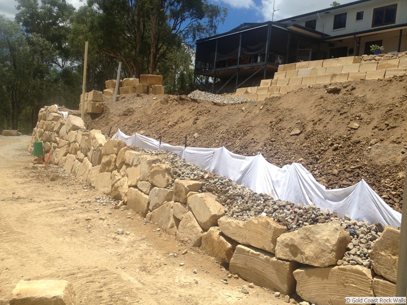 Boulder retaining wall before completion