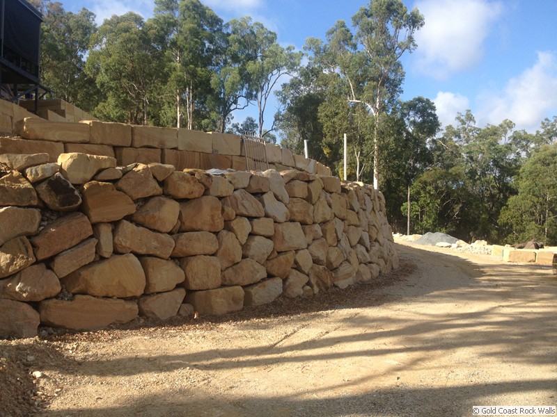 Carved and natural rock wall construction