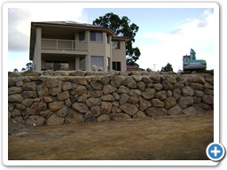 Boulder wall construction