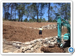 Rock retaining wall construction